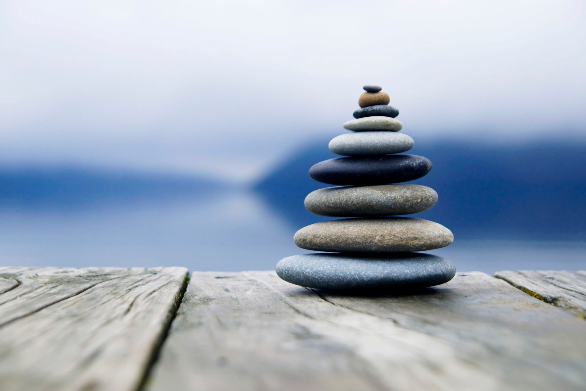 zen-balancing-pebbles-misty-lake